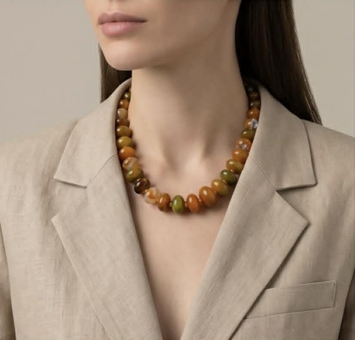 Top quality Rare Unusual Natural Mookiate .925 Sterling Silver Necklace - Mookaite necklace worn, front view, beige blazer backdrop.