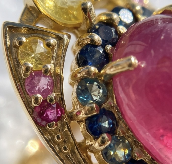 King of Gems Genuine 24.5 CARAT Mozambique Ruby 18K Gold over .925 Sterling Silver Large Statement Ring size 9 - Close-up of colorful gemstones set in gold with a large Mozambique ruby.