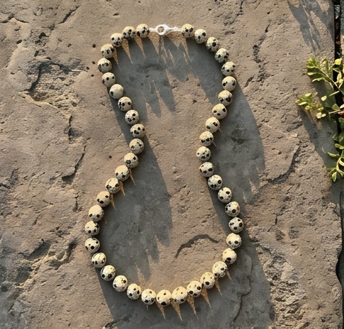 Nature Inspired genuine Dalmatian Jasper .925 Sterling Silver handmade necklace - Nature-inspired Dalmatian Jasper necklace, aerial view on stone surface.