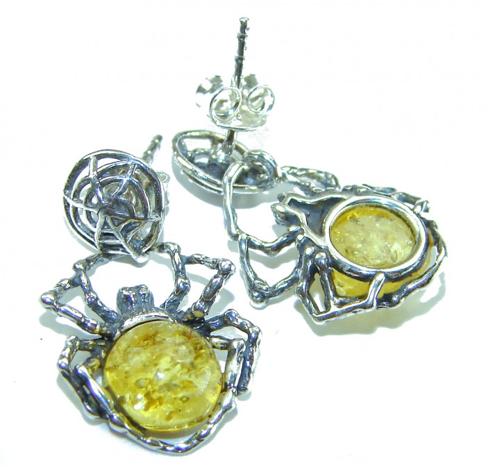 Golden Spiders authentic Baltic Amber .925 Sterling Silver earrings - Earrings with spider design, amber stone close-up, sterling silver detail.