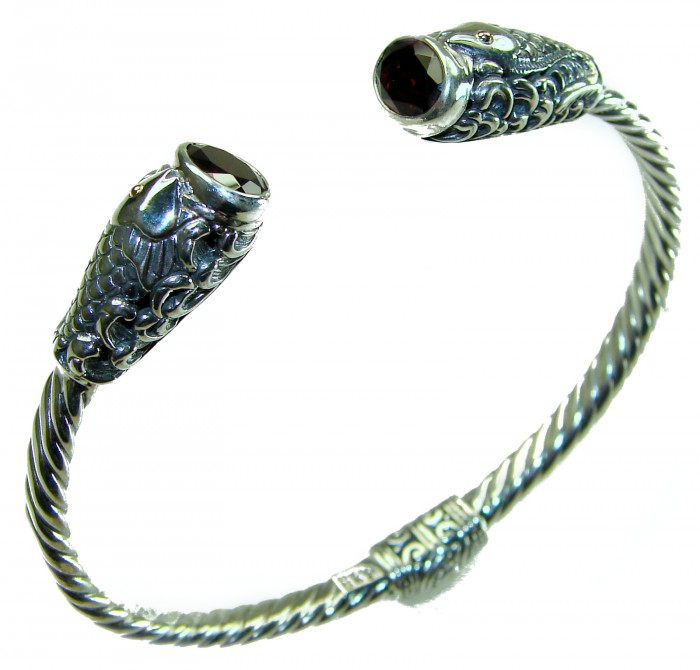 Two Fishes 5.5 carat Mozambique Garnet .925 Sterling Silver handcrafted Statement Bracelet / Cuff - Angled view of Two Fishes Garnet Sterling Silver bracelet.