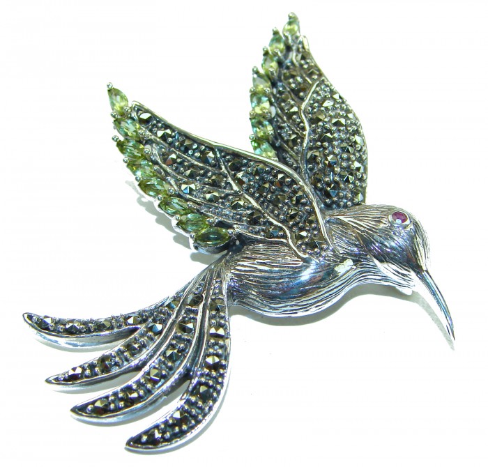 Incredible Flaying Bird Natural 5.9 carat Peridot Marcasite .925 Sterling Silver Brooch - Flying bird brooch with peridot and marcasite, angled side view.