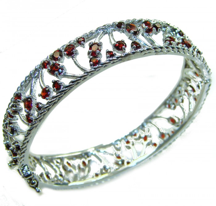 Authentic 18.2 carat Garnet .925 Sterling Silver handmade bangle Bracelet - Side view of sterling silver bracelet with garnet stones.