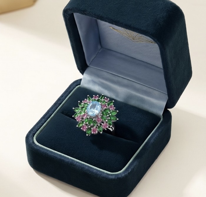 Exquisite 19.7 carat Swiss Blue Topaz rhodium over .925 Sterling Silver Handcrafted Statement Ring size 9 - Luxurious ring in box, top view of blue topaz with emerald and pink gems