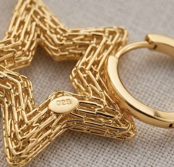 Golden Stars- Dubai Style - .925 Sterling Silver dipped in 22K Gold handmade Earrings - Close-up of star-shaped earring in gold, showcasing clasp and .925 stamp.
