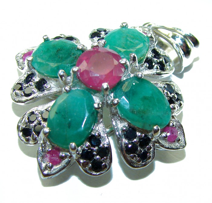 Spectacular 28.8 carat authentic Colombian Emerald .925 Sterling Silver handcrafted Pendant - Flower-shaped emerald and ruby pendant close-up, showcases stones.