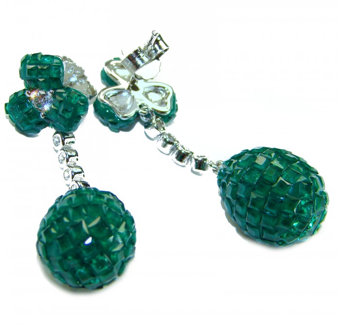 Giovanna - Authentic 21.9 carat Emerlad .925 Sterling Silver handcrafted earrings - Close-up of green gemstone earrings on white background.