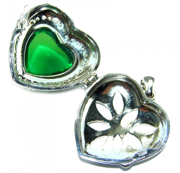 Secret compartment Authentic 18.5 carat Green Helenite .925 Sterling Silver Pendant - Open heart-shaped locket showing green Helenite stone and floral cutout.