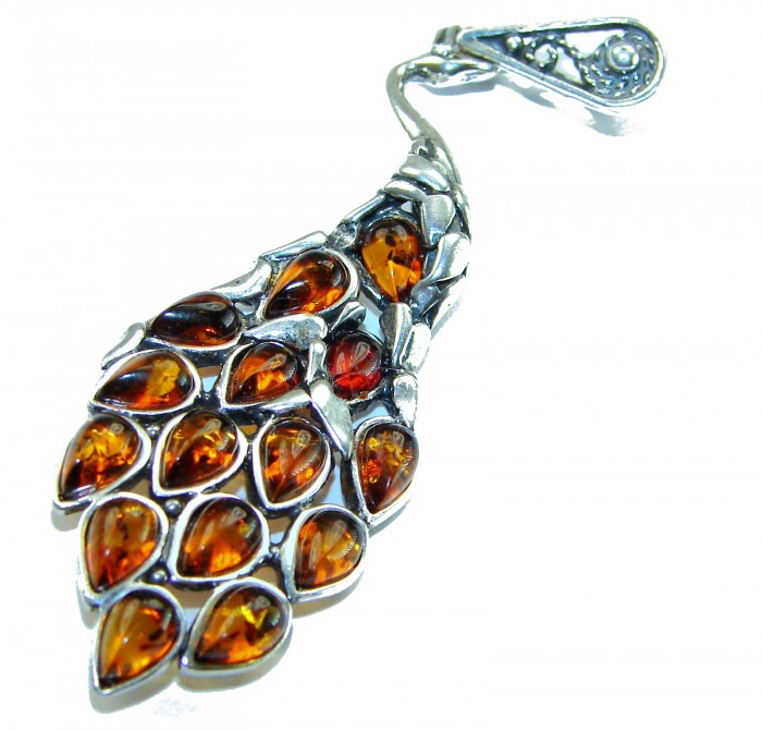 2 3/4 inches! Peacock Prehistoric Authentic Baltic Amber .925 Sterling Silver beautifully handcrafted Pendant - Intricate peacock pendant with amber stones, top-down view.