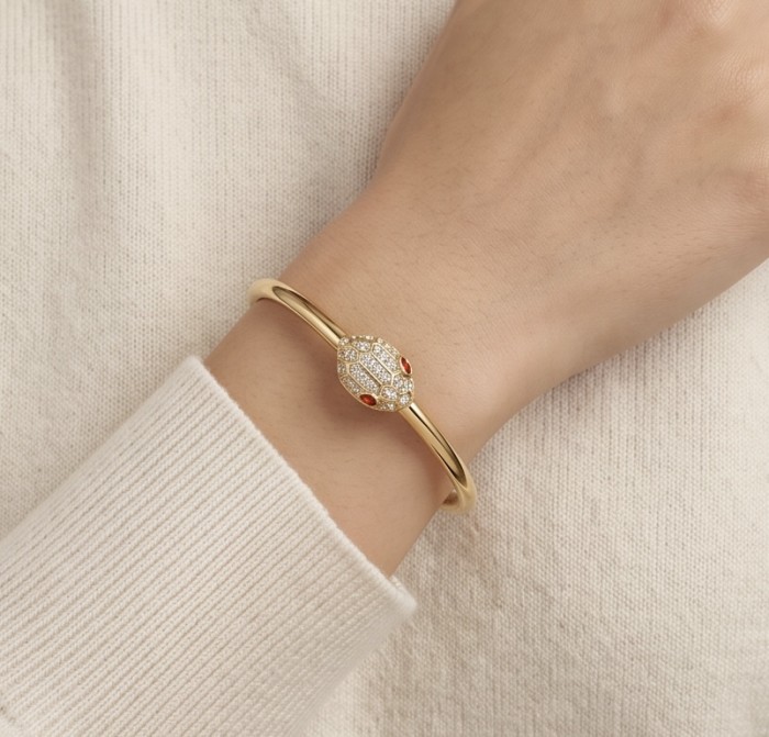 Precious Boa Snake Genuine 0.7 carat orange Sapphire .925 Sterling Silver dipped in 14K Gold handcrafted Bracelet - Bracelet worn on wrist, gold snake design with orange sapphires and crystals.