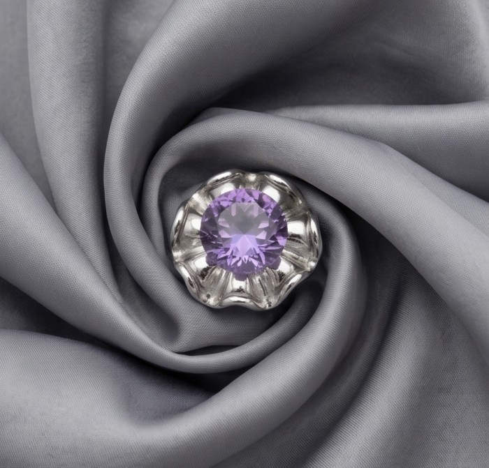 Flower 12.5 carat Amethyst .925 Sterling Silver Handcrafted Ring size 6 - Amethyst gemstone in silver setting on grey fabric, top view.