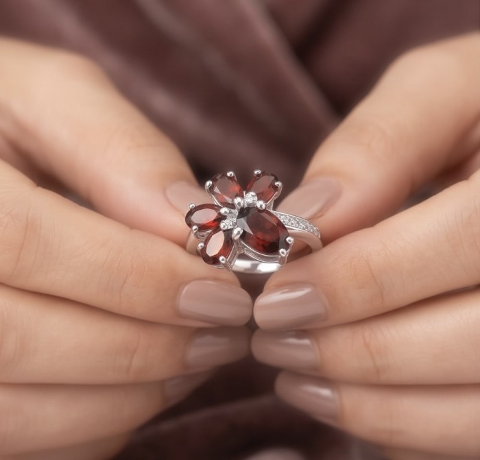 Precious Garnet - authentic 5.2 carat Garnet .925 Sterling Silver Ring size 7 - Close-up of Precious Garnet ring with red gems held in hands