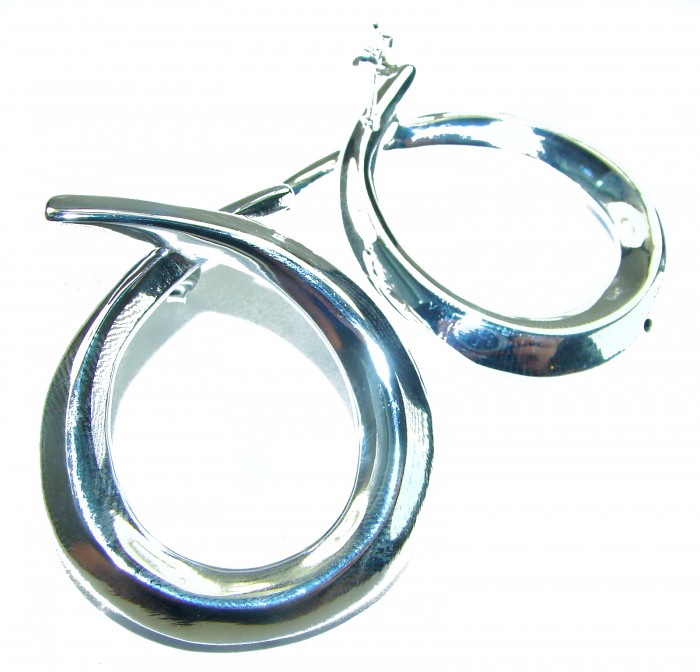 Large 1 5/8 inches long highly polished .925 Sterling Silver Italy made Earrings - Close-up of large polished sterling silver earrings, top view.