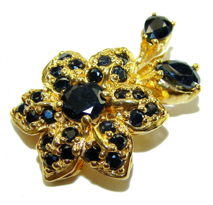 Authentic 10.5 carat faceted Sapphire 14K Gold over .925 Sterling Silver handcrafted Statement Pendant - Close-up of sapphire and gold floral jewelry piece.
