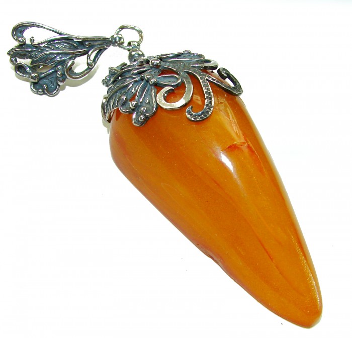 Large 3 3/4 inches Prehistoric Authentic Baltic Amber .925 Sterling Silver beautifully handcrafted Pendant - Close-up of large Baltic amber pendant with ornate silver details.
