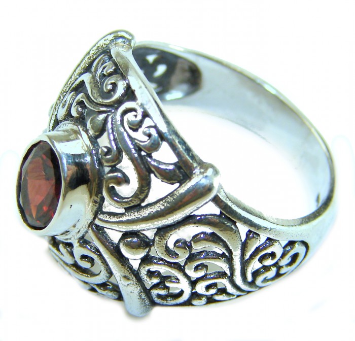 4.5 carat oval cut Red Garnet .925 Sterling Silver handcrafted ring; s. 7 1/4 - Side view of ornate .925 sterling silver ring with red garnet stone.