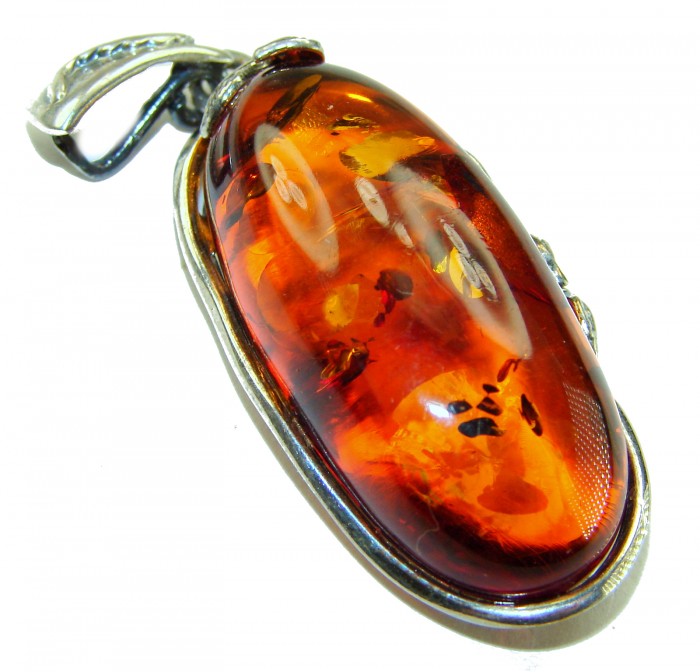 Prehistoric Authentic Baltic Amber .925 Sterling Silver beautifully handcrafted Pendant - Amber pendant stone close-up with sterling silver setting