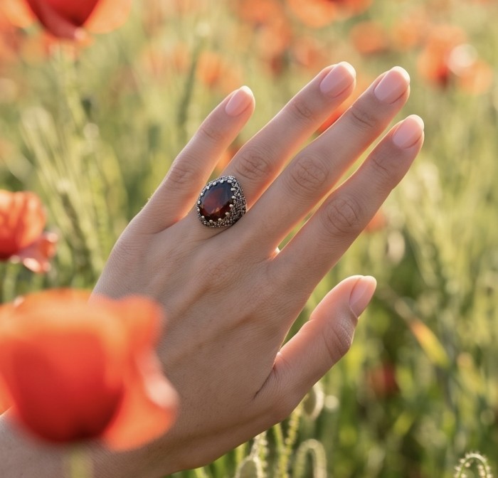 Red Mystery Authentic 18.4 carat Garnet .925 Sterling Silver brilliantly handcrafted large Statement Ring size 7 - Hand wearing Red Mystery Garnet ring in field of poppies.