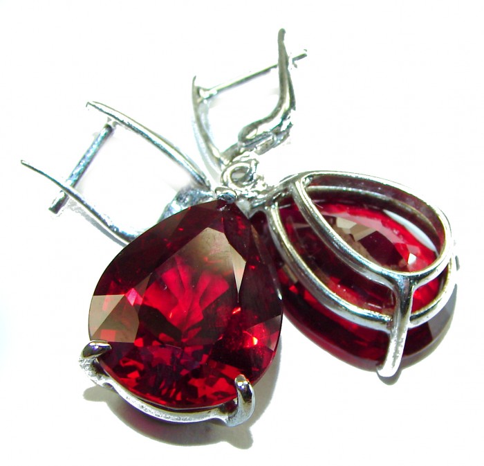 Blooming Rose pear cut 26.5 carat Red Topaz .925 Sterling Silver handmade Statement earrings - Close-up of Blooming Rose pear cut red topaz earrings in silver settings.