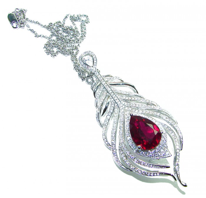 Authentic 12.5 carat faceted Australian Garnet .925 Sterling Silver handcrafted necklace pendant brooch - Peacock feather design with red garnet and diamonds, close-up view.