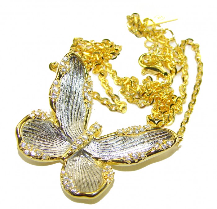 Golden Butterfly White Topaz highly polished 18K Gold over .925 Sterling Silver Italy made necklace - Close-up of gold butterfly necklace with white topaz, chain in background.