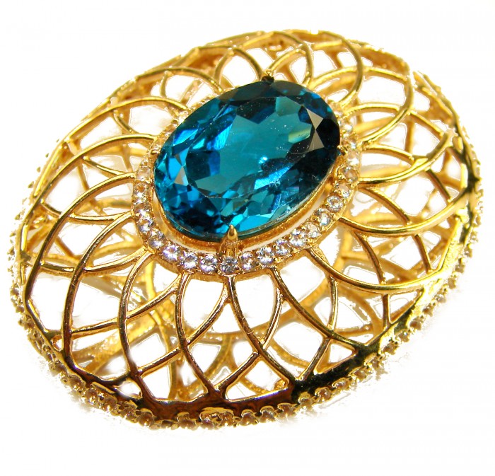 Blue Island - 8.2 carat London Blue Topaz 18K Gold over .925 Sterling Silver handmade Pendant - Oval brooch with blue topaz and gold filigree design, close-up view.