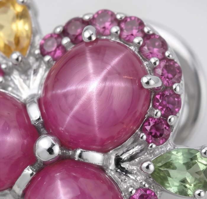 Exotic Flowers - 10.8 carat Mozambique Ruby .925 Sterling Silver dipped in rhodium handmade Statement Earrings - Close-up of Exotic Flowers jewelry with ruby and gems in sterling silver.