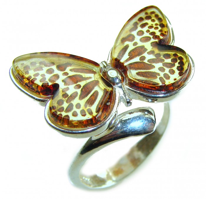 Butterfly Authentic carved Baltic Amber .925 Sterling Silver handcrafted ring; s. 8 adjustable - Butterfly amber ring in silver, top view, intricate wing detail.