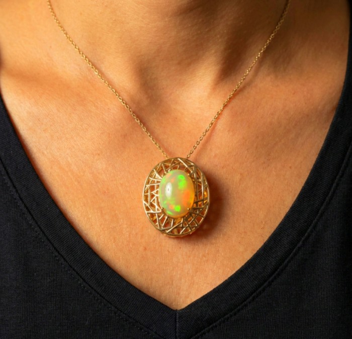Earth Treasure Authentic 16.8 carat Golden Ethiopian Opal 22K Gold over .925 Sterling Silver handcrafted Statament Necklace - Necklace with Ethiopian opal worn on neck, front view.