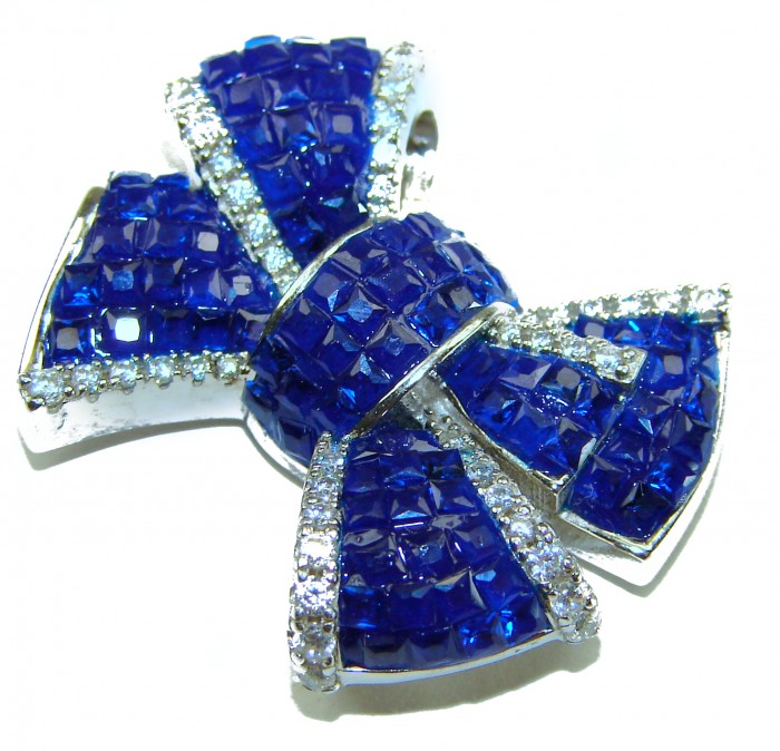 Heirloom blue Bow Genuine 17.5 carat Sapphire .925 Sterling Silver handmade Pendant - Close-up of heirloom blue bow sapphire brooch with silver accents.