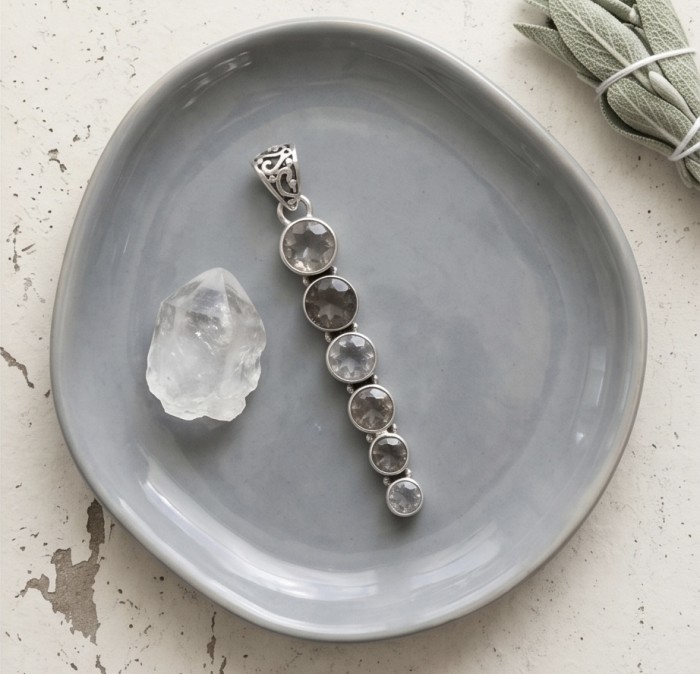 Penelope - 21.5 carat Smoky Topaz .925 Sterling Silver handmade Pendant - Penelope Smoky Topaz pendant on plate, top-down view.