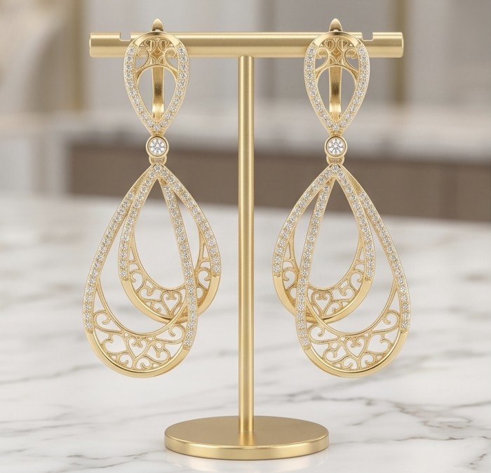 Black Label Collection - Dubai Style - Natural 22K Gold over .925 Sterling Silver handmade earrings - Front view of ornate gold earrings on a stand.