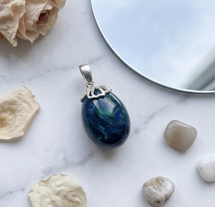 Mystery 10.8 CTW Authentic Black Opal 14K Gold over .925 Sterling Silver handmade Pendant - Black opal pendant with silver setting on marble with petals and stones.