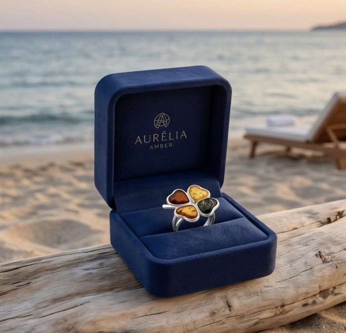 Flower Authentic Baltic Amber .925 Sterling Silver dipped in rhodium handcrafted ring; s. 8 adjustable - Baltic amber ring in box, beach background, four heart-shaped stones.