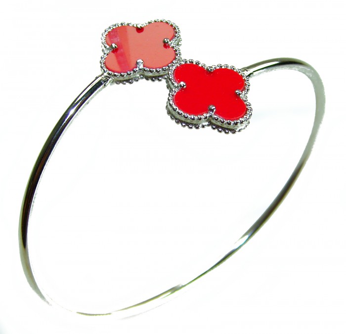 A Red four-leaf clover Coral .925 Sterling Silver handcrafted Bracelet - Red clover coral bracelet, side view, sterling silver band.