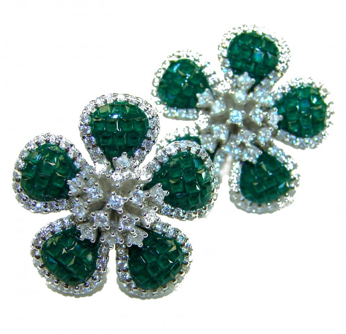 Born to Glam authentic 24.4 carat Colombian Emerald .925 Sterling Silver handcrafted Statement earrings - Emerald flower earrings, stone close-up, white background.