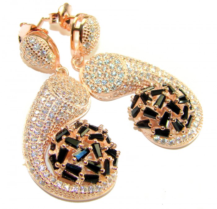 Giovanna - Authentic 22.5 carat Sapphire 18K Rose Gold over .925 Sterling Silver handcrafted earrings - Close-up of sparkling rose gold earrings with black sapphires.