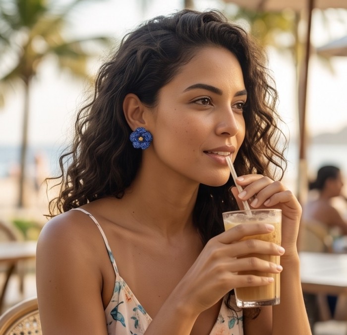 Amazonia - 8.8 carat pave Colombian Sapphire .925 Sterling Silver handmade Statement Earrings - Worn on model, Amazonia Colombian Sapphire earrings, beach background.