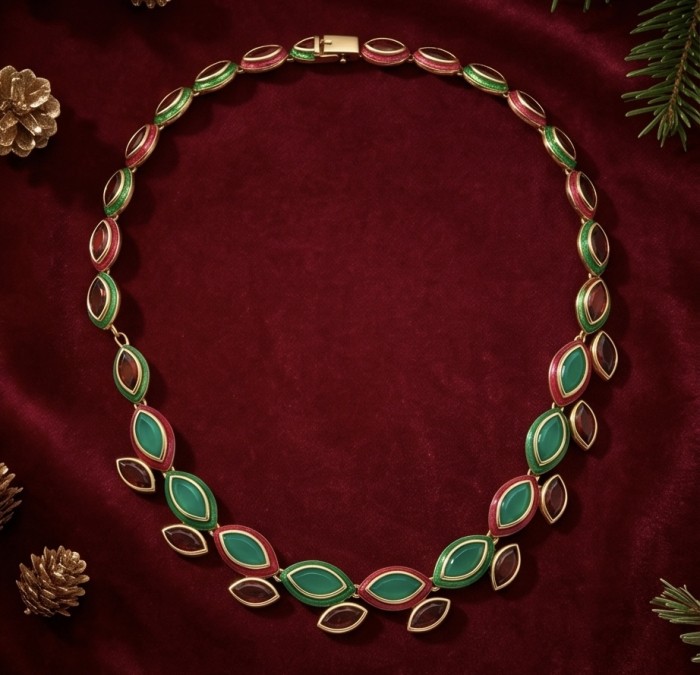 Outstanding - Red Rose - Authentic 28.2 carat Colombian Emerald Kashmir 24.8 carat Ruby Enamel 22K Gold over .925 Sterling Silver handcrafted necklace - Necklace on red velvet, top view, festive pinecone decor.