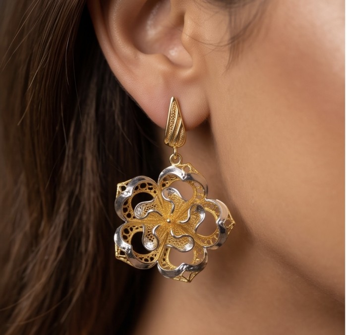 Golden Roses Dubai Style - .925 Sterling Silver dipped in 22K Gold handmade Earrings - Close-up of decorative floral earring in gold and silver on an ear