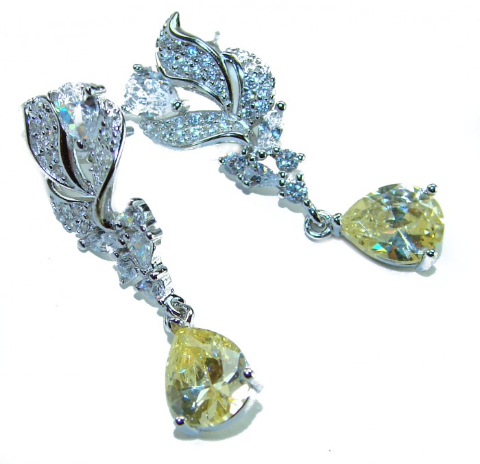 Authentic 4.5 carat Citrine .925 Sterling Silver brilliantly handcrafted earrings - Sterling silver earrings with citrine stones, side view.