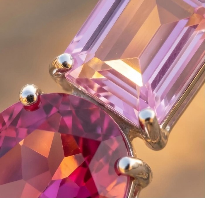 Marvelous Natural 20.8 carat Pink Sapphire .925 Sterling Silver Handcrafted pendant - Close-up of pink sapphire stones in a sterling silver setting.