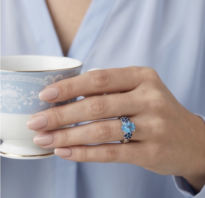 Pacifica 1.5 carat authentic Swiss Blue Topaz .925 Sterling Silver handmade Statement Ring size 7 1/2 - Ring with Swiss Blue Topaz worn on hand holding a teacup
