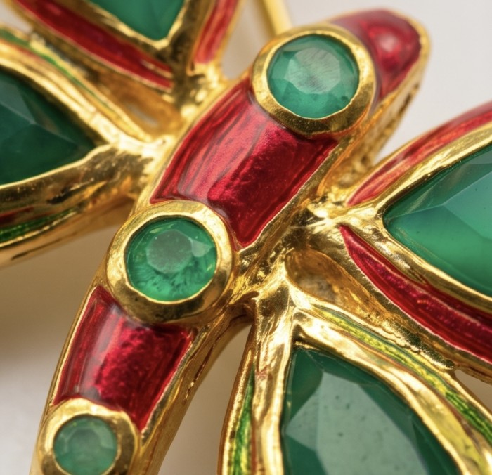 Green Buttrefly - 18.5 carat Authentic Emerald Enamel 22 carat Gold .925 Sterling Silver handcrafted Brooch - Close-up of butterfly jewelry with green emeralds and red enamel accents.