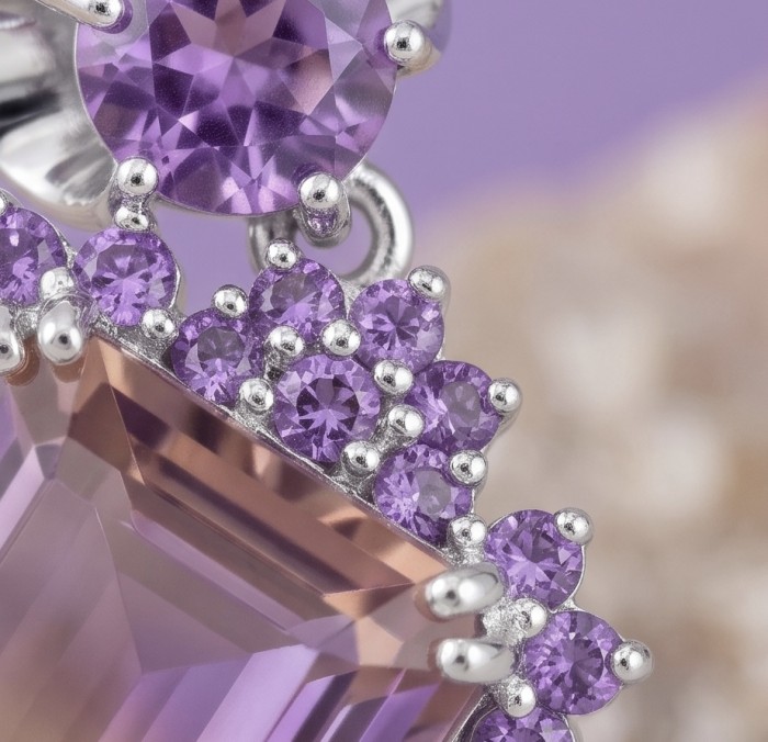Charlotte Authentic 14.4 carat Green Ametrine rhodium over .925 Sterling Silver handcrafted Statement Earrings - Close-up of Charlotte 14.4 carat purple gemstone with small stones surrounding it.