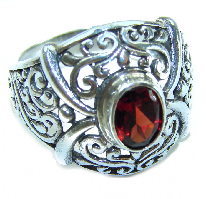 4.5 carat oval cut Red Garnet .925 Sterling Silver handcrafted ring; s. 7 1/4 - Close-up of a red garnet in ornate sterling silver filigree ring.