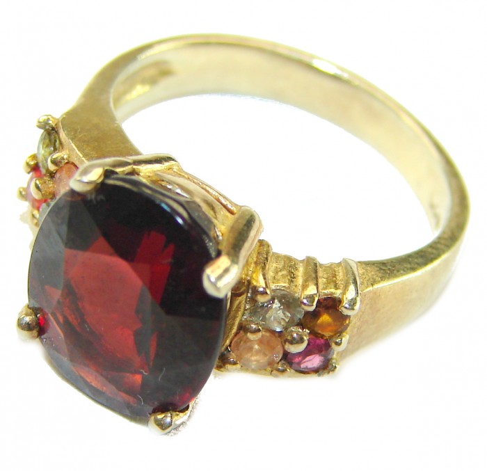 Passion 10.5 carat round cut Red Garnet .925 Sterling Silver handcrafted ring; s. 6 1/2 - Side view of a red garnet ring with multicolored accent stones.