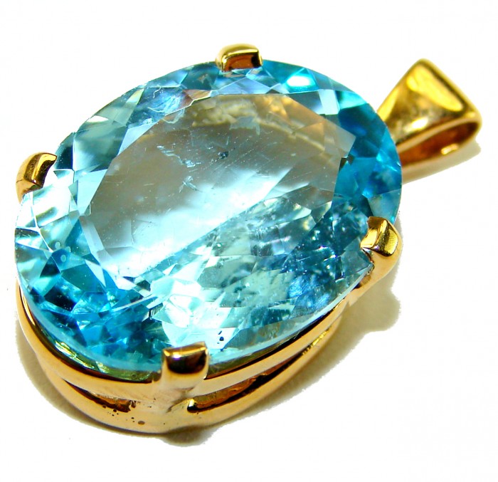 Atlantica oval cut 22.9 carat Swiss Blue Topaz 18K Gold over .925 Sterling Silver Handcrafted Pendant - Close-up of oval-cut Swiss Blue Topaz pendant in 18K gold setting.
