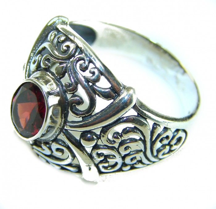 4.5 carat oval cut Red Garnet .925 Sterling Silver handcrafted ring; s. 9 - Ornate sterling silver ring with red garnet, detailed side view.