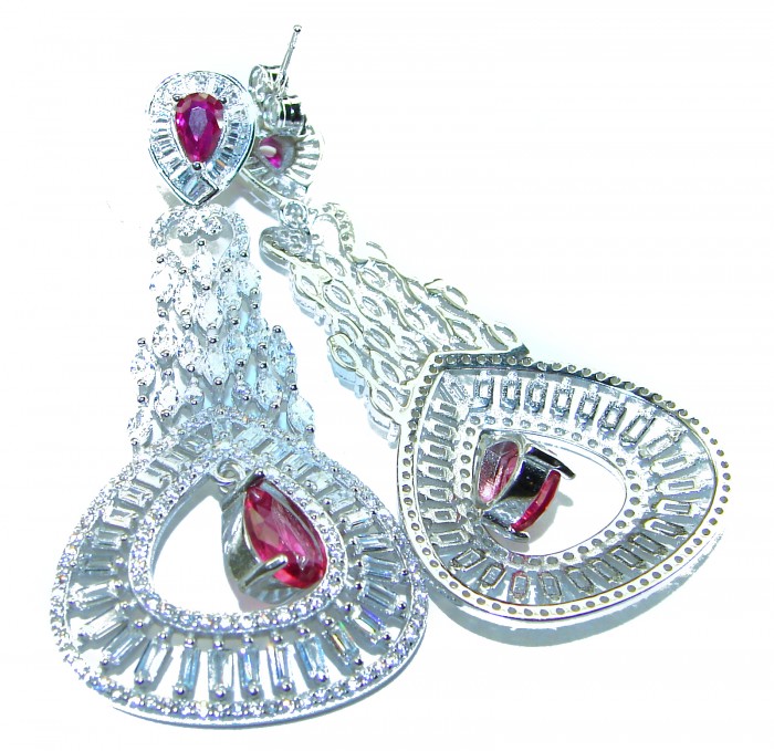 Pure Luxury 22.2 carat natural Ruby .925 Sterling Silver handmade Statement earrings - Close-up of ruby and silver earrings with intricate detailing.